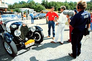 Driver Walter Rothlauf (in red shirt) and his 1928 
Bugatti Tourer