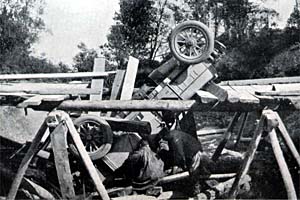 An Itala roadster overturned by the collapse of a bridge 
during the 1907 Peking to Paris Road Rally