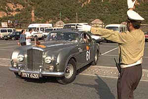Chinese police direct Peter and Susan Noble's 1955 
Bentley.